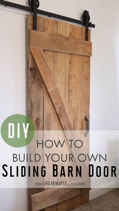 a sliding barn door with the words diy how to build your own sliding barn door