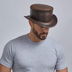 Unbanded Brown Marlow Top Hat by American Hat Makers Rugged Leather Hat Bands, Fitted Leather Top Hat With Short Brim, Brown Leather Top Hat With Short Brim, Fitted Leather Hat With High Crown, Fitted Leather Hats For Western-themed Events, Vintage Leather Hat Bands For Flat Crown, Steampunk Leather Hat Band With Short Brim, Fitted Leather Top Hat With Flat Brim, Vintage Brown Top Hat With Flat Crown