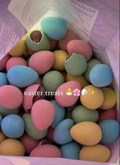 some kind of colorful candy in a purple bag with the words easter treats written on it