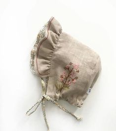 a small pouch with pink flowers on it