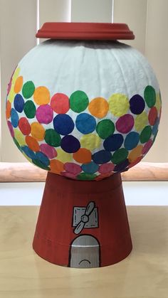 a paper mache ball sitting on top of a wooden table