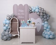 a baby's room decorated with balloons and decorations