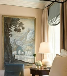 a bedroom with a painting on the wall next to a bed and two nightstands