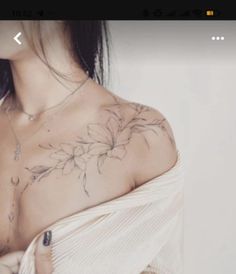 a woman with a flower tattoo on her chest