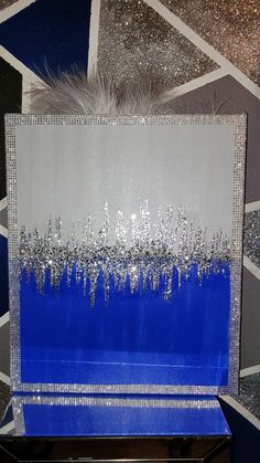 a blue box with silver glitters on it