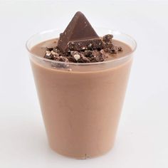 a chocolate dessert in a plastic cup on a white background