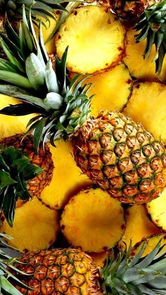 pineapples and bananas are piled up together