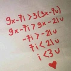 the numbers are written in red ink on a sheet of paper that has hearts drawn on it