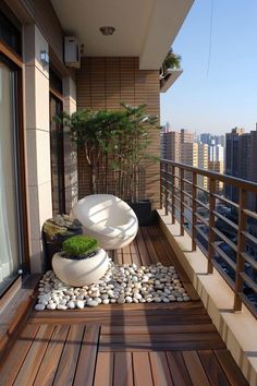 a balcony with rocks and plants on it