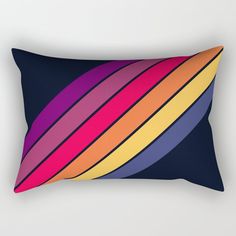 a rectangular pillow with multicolored stripes on it