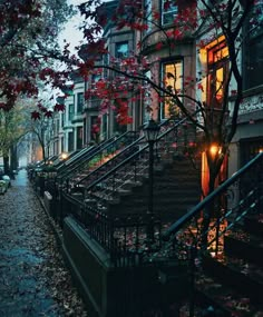 an alleyway with stairs and trees in the fall