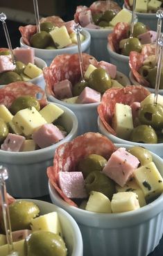 several bowls filled with different types of food