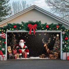 a garage decorated for christmas with santa and reindeers in front of the garage door