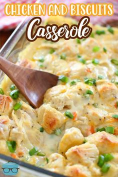 chicken and biscuits casserole in a pan with a wooden spoon