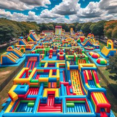 an inflatable water park is shown with many slides and bounquets