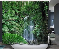 a shower curtain with a waterfall surrounded by lush green foliage