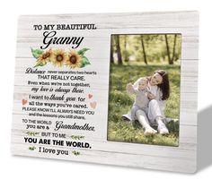 a wooden frame with an image of a woman holding a baby and the words to my beautiful granny