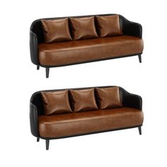 two brown and black leather couches with pillows on the back, side by side