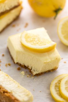 slices of cheesecake with lemons on the side