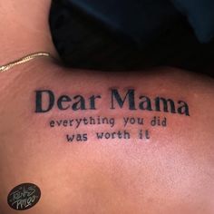 a person with a tattoo on their back saying dear mama everything you did was worth it