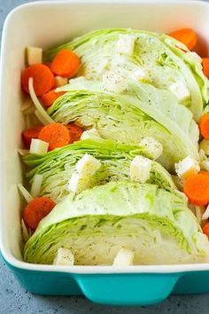 lettuce and carrots in a blue dish