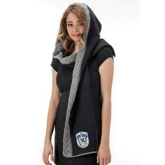 a woman wearing a scarf with a badge on it