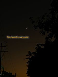 an image of the moon and some power lines in the night sky with words written on it