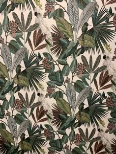 an image of a wallpaper with leaves and pineconis on it's surface