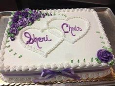 a cake with two hearts and purple flowers on it that says sheri, chees