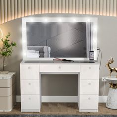 a white desk topped with a mirror and lights