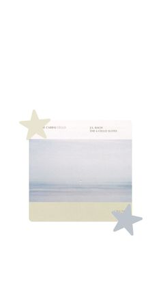 a card with two stars on it and the ocean in the background, as well as text