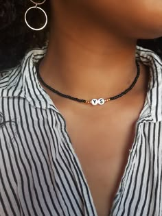 "Dainty Letter Choker, Name Choker, Personalized Choker, Initial Choker ---------- P R O C E S S ----------- This choker is made with size 8 Seed Beads and acrylic alphabet beads. The beads are strung onto durable stretch cord. It comes with a lobster clasp closure + a 2\" extender chain. --------- S I Z E S ---------- This choker is avaliable in the following lengths: 11 inches 11.5 inches  12 inches  12.5 inches  13 inches 13.5 inches 14 inches  14.5 inches 15 inches  15.5 inches 16 inches  *S Cheap Adjustable Letter Beads Choker, Black Necklaces With Round Letter Beads, Black Round Bead Jewelry With Letter Details, Black Beaded Necklace With Letter Beads, Black Letter Round Beads, Black Beaded Necklace With Letter And Round Beads, Black Adjustable Beaded Necklace With Letter Beads, Adjustable Black Beaded Necklace With Letter Beads, Black Beaded Necklaces With Heart-shaped Beads