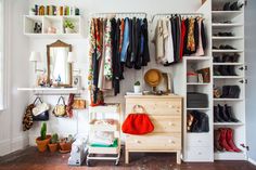 the closet is full of clothes and other things to be seen in this article,