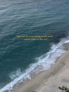 an aerial view of the ocean and beach with a quote written in yellow on it