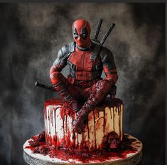 a deadpool cake with blood dripping all over it