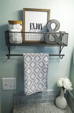 the bathroom is decorated in gray and white