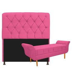 a pink and black upholstered bed with footstool in front of it