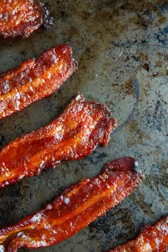 bacon strips sitting on top of a metal pan