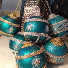 several christmas ornaments are sitting on a table