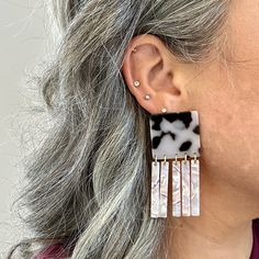 These earrings are all about movement! Features a bold square stud in a black and white tortoise hand-swirled acrylic with a complementary light lavender flirty fringe detail. ▪️Length: 2.75", Width: 1.25"▪️Materials: acrylic, brass base posts/jump rings with 18k gold plating▪️Hypoallergenic▪️All earrings come with specialized backs to maintain the integrity of the product. As with all fused materials please be mindful of your use of force. Handle with care. Small variations can happen in the pr Alphabet Jewelry, Light Lavender, Mini Hoop Earrings, Stocking Fillers For Her, Forever Jewelry, Square Stud, Jewelry Ring Box, Men's Jewelry Rings, Pittsburgh Pa