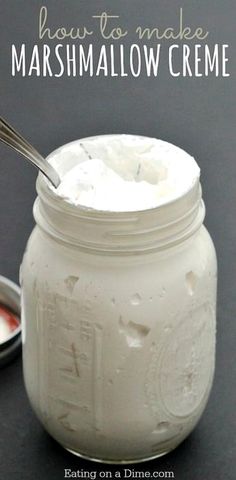 homemade marshmallow creme in a mason jar with spoon and bowl on the side