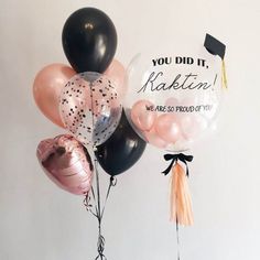 there are balloons that say you did it rabitn we are proud of you