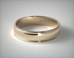 a gold wedding band with the name james avery engraved on it's center piece