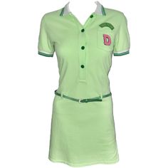 a women's green dress with a pink letter on the chest and collared neckline