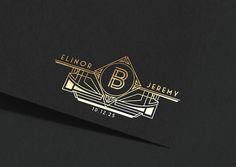 a black and gold business card with the letter b on it's front side