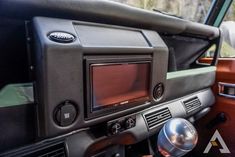 there is a car radio in the center of the vehicle's dash board and dashboard