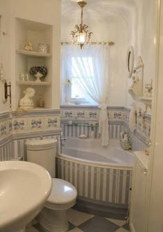 the bathroom is decorated in blue and white