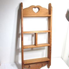 "Vintage handmade rustic shabby shadowbox shelf is 30\" high x 13\" wide x 3\" deep with display spaces.  Coming to you AS IS. The top shelf is 2\" deep because of the back board, the rest are 3\" deep.  The shelves are roughly 5 1/2\" to 6\" apart.  The center shelf is divided into 2 spaces each about 5 1/4\" wide x 5 1/2\" high. There are hammer marks on the back by the heart.. (See last photo)  Nothing for hanging. V flip hangers included, buyer can decide where to put them.  Previously loved Wooden Heart Decor, Rustic Heart Decor, Shadow Box Shelf, Trinket Shelf, Shadow Box Shelves, Vintage Living Room Decor, Shelves Furniture, Thrift Ideas, Antique Shelves