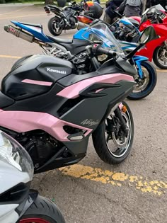 several motorcycles parked next to each other in a parking lot