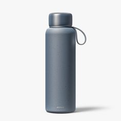 thermos stainless steel water bottle is shown with a loop around it's neck